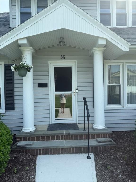 16 Cobbles E, Elmira, NY 14905 - property entrance featuring a shingled roof and covered porch