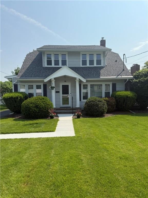 16 Cobbles E, Elmira, NY 14905 - view of front of property with a chimney, a front lawn, and a shingled roof
