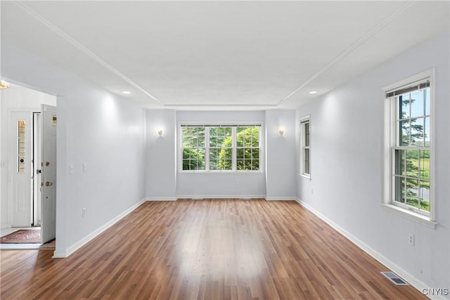 1 Wicklow Dr, Skaneateles, NY 13152 - empty room with plenty of natural light, wood finished floors, baseboards, and recessed lighting