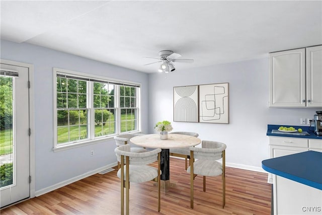 1 Wicklow Dr, Skaneateles, NY 13152 - dining area featuring baseboards, light wood-type flooring, and a ceiling fan
