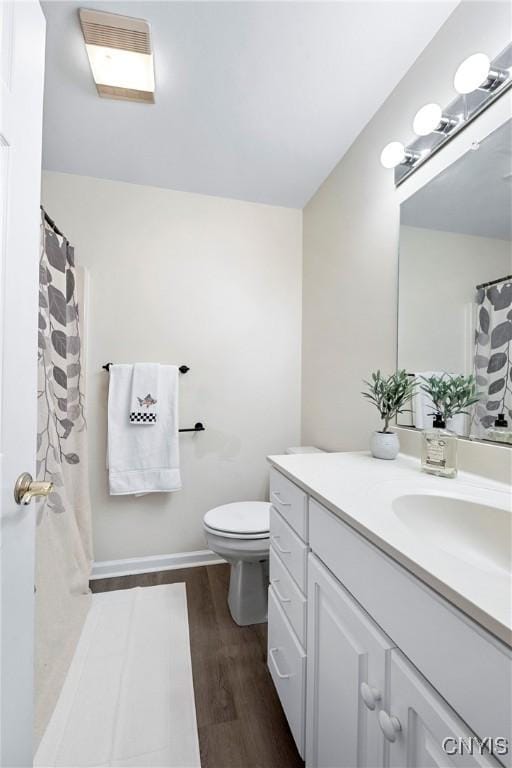 1 Wicklow Dr, Skaneateles, NY 13152 - bathroom featuring vanity, toilet, wood finished floors, and a shower with curtain