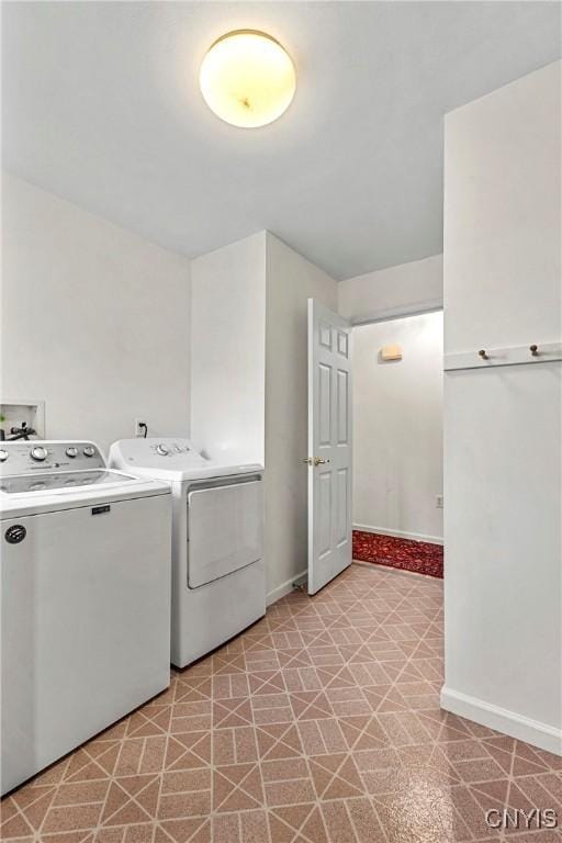 1 Wicklow Dr, Skaneateles, NY 13152 - laundry room with washing machine and clothes dryer and baseboards