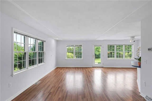 1 Wicklow Dr, Skaneateles, NY 13152 - unfurnished living room with baseboards, wood finished floors, and ceiling fan