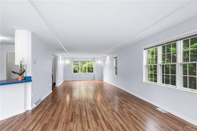1 Wicklow Dr, Skaneateles, NY 13152 - unfurnished living room featuring baseboards and wood finished floors