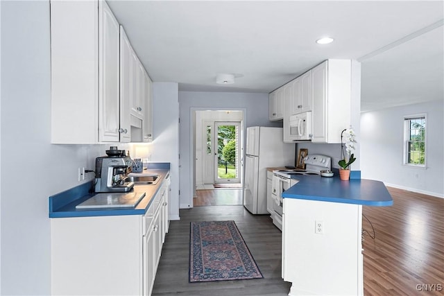 1 Wicklow Dr, Skaneateles, NY 13152 - kitchen with white appliances, healthy amount of natural light, a peninsula, white cabinetry, and recessed lighting