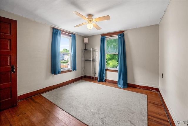172 Nichols Ave, Syracuse, NY 13206 - unfurnished room featuring wood finished floors, a ceiling fan, and baseboards
