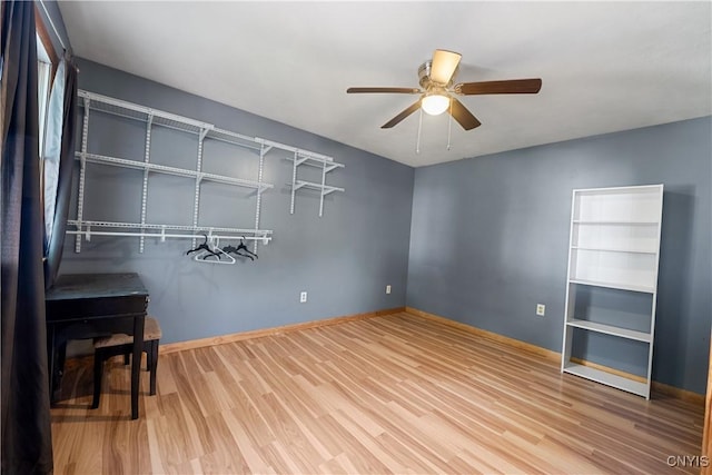 172 Nichols Ave, Syracuse, NY 13206 - unfurnished bedroom featuring wood finished floors, baseboards, and a ceiling fan