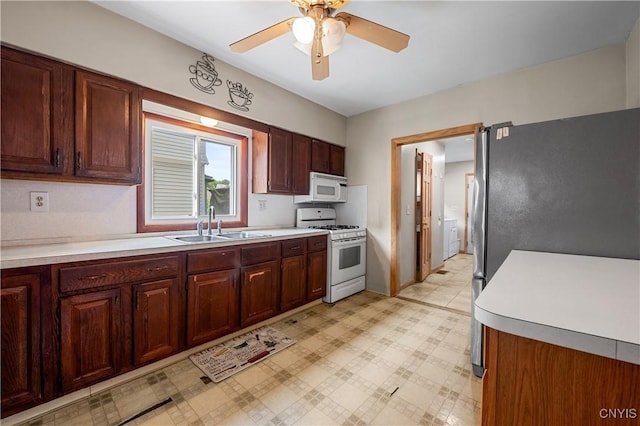 172 Nichols Ave, Syracuse, NY 13206 - kitchen with white appliances, a sink, light countertops, ceiling fan, and light flooring