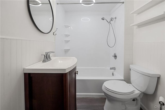 172 Nichols Ave, Syracuse, NY 13206 - bathroom featuring tub / shower combination, vanity, toilet, wood finished floors, and wainscoting