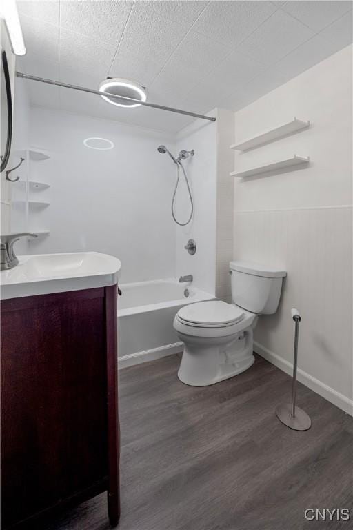 172 Nichols Ave, Syracuse, NY 13206 - bathroom featuring bathing tub / shower combination, vanity, toilet, wood finished floors, and a textured ceiling