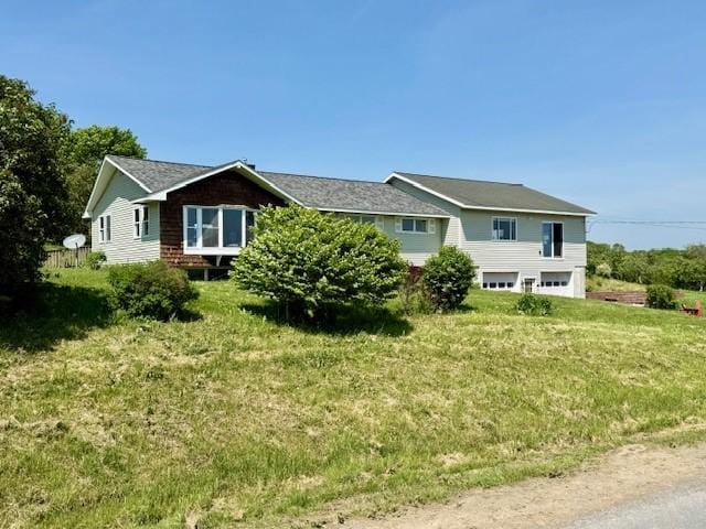 251 Pearsall Rd, Westford, NY 12155 - view of front of house with a garage and a front yard
