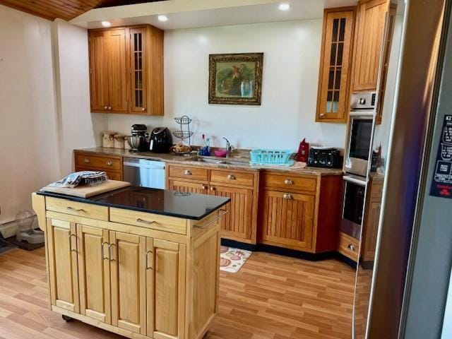 251 Pearsall Rd, Westford, NY 12155 - kitchen featuring stainless steel appliances, light wood finished floors, glass insert cabinets, recessed lighting, and a sink