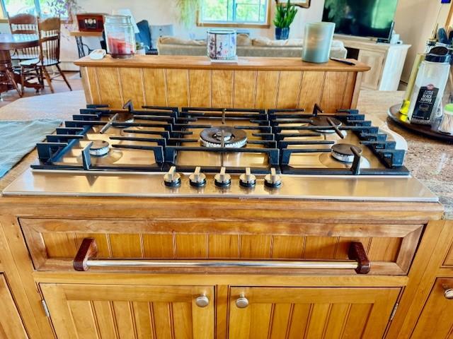 251 Pearsall Rd, Westford, NY 12155 - detailed view of stainless steel gas stovetop and brown cabinets