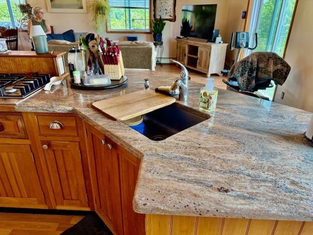 251 Pearsall Rd, Westford, NY 12155 - kitchen featuring plenty of natural light, light stone countertops, and open floor plan