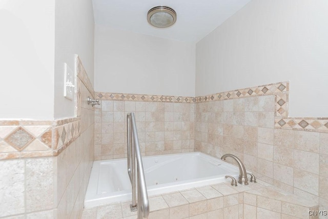 4190 Stepping Stone Ln, Clay, NY 13090 - bathroom with a tub with jets and tile walls