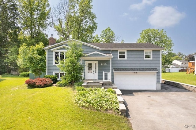 4190 Stepping Stone Ln, Clay, NY 13090 - bi-level home with a chimney, driveway, a garage, and a front yard