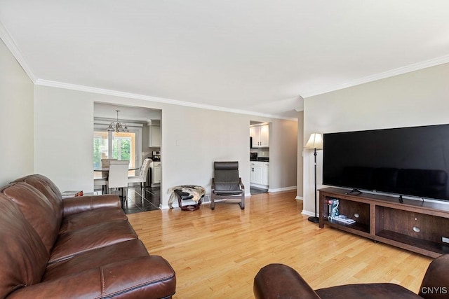 4190 Stepping Stone Ln, Clay, NY 13090 - living room featuring crown molding, light wood-style flooring, a chandelier, and baseboards