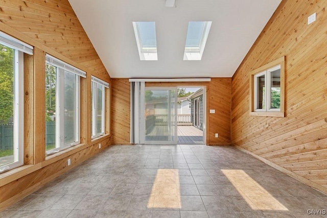 4190 Stepping Stone Ln, Clay, NY 13090 - unfurnished sunroom with lofted ceiling, wood walls, plenty of natural light, and a skylight