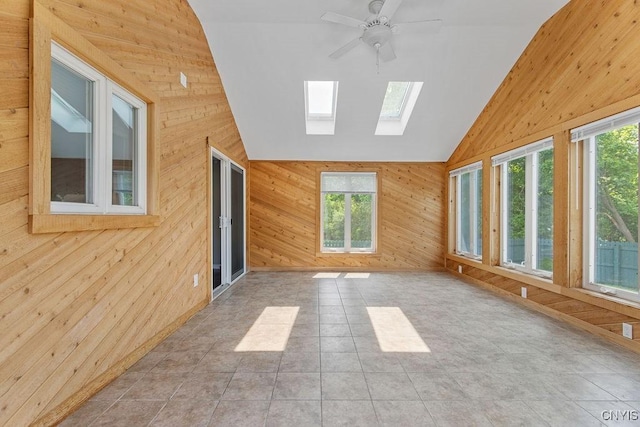4190 Stepping Stone Ln, Clay, NY 13090 - unfurnished sunroom with wood walls, vaulted ceiling, a skylight, and tile patterned flooring