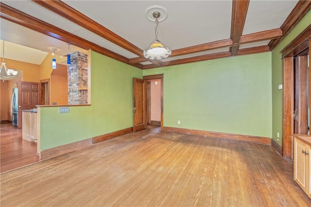 1579 Culver Rd, Rochester, NY 14609 - unfurnished living room featuring wood finished floors, beam ceiling, and baseboards