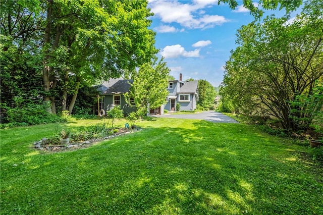 1579 Culver Rd, Rochester, NY 14609 - view of green lawn with driveway