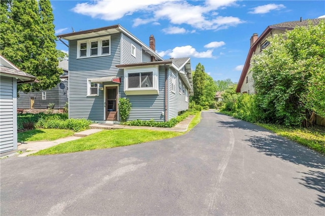 1579 Culver Rd, Rochester, NY 14609 - view of front of home featuring a chimney
