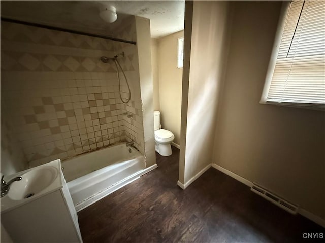 131 Lakeview Ave, Syracuse, NY 13204 - bathroom with toilet, tub / shower combination, wood finished floors, vanity, and baseboards