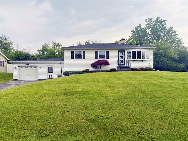 2988 E Ave, Waterloo, NY 13165 - view of front of house featuring asphalt driveway, a chimney, a front lawn, and a garage