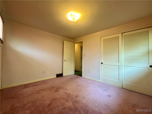21 Kathy Ln, West Seneca, NY 14224 - unfurnished bedroom with baseboards, carpet floors, and a closet