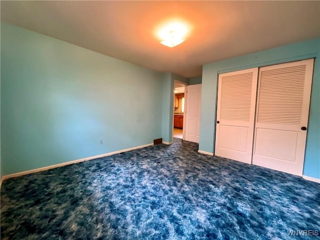 21 Kathy Ln, West Seneca, NY 14224 - unfurnished bedroom with baseboards, carpet, and a closet