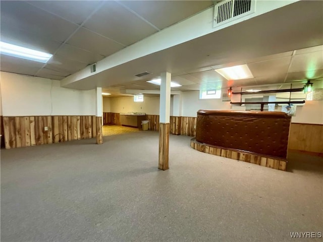 21 Kathy Ln, West Seneca, NY 14224 - basement featuring wainscoting, a paneled ceiling, wooden walls, and a bar