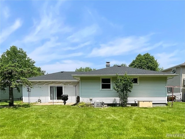 21 Kathy Ln, West Seneca, NY 14224 - rear view of property featuring a yard, central AC, a patio area, and roof with shingles