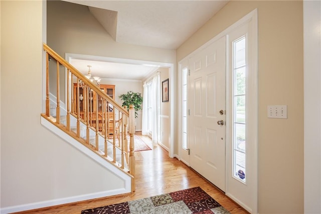 2 Princeton Ln, Perinton, NY 14450 - foyer entrance with a chandelier, light wood-type flooring, and stairway