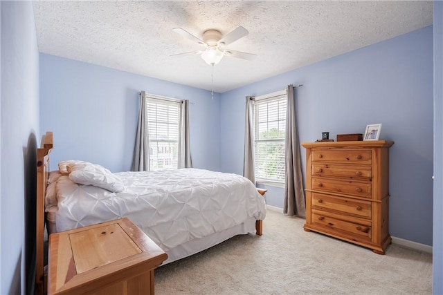 2 Princeton Ln, Perinton, NY 14450 - bedroom with a textured ceiling, light carpet, baseboards, and a ceiling fan
