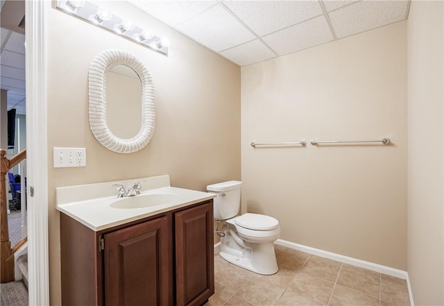 2 Princeton Ln, Perinton, NY 14450 - half bath with a drop ceiling, vanity, toilet, baseboards, and tile patterned floors