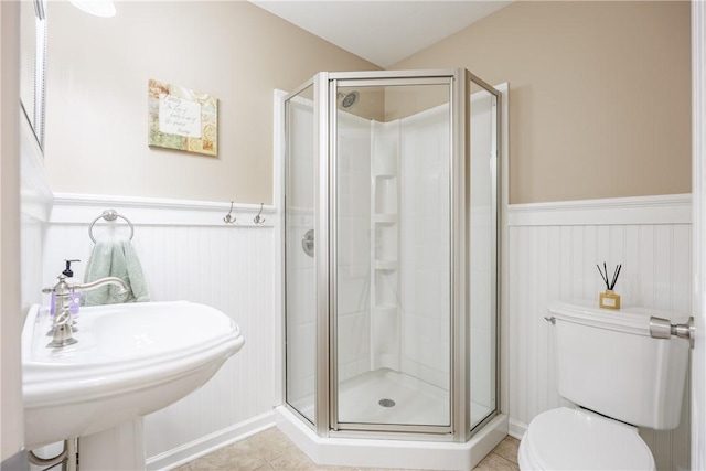 2 Princeton Ln, Perinton, NY 14450 - bathroom featuring a shower stall, toilet, wainscoting, and tile patterned flooring