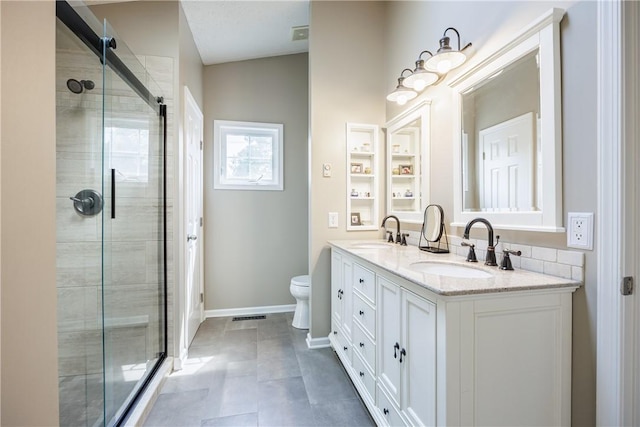 2 Princeton Ln, Perinton, NY 14450 - full bathroom featuring double vanity, baseboards, a shower stall, and toilet