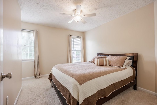 2 Princeton Ln, Perinton, NY 14450 - bedroom with light colored carpet, multiple windows, a textured ceiling, and baseboards