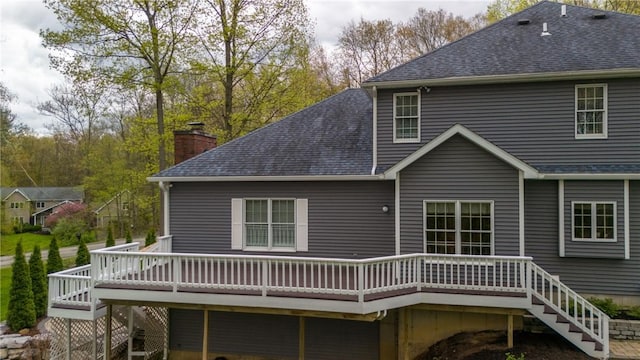 256 Queen Esther Dr, Sayre, PA 18840 - back of property featuring a deck, a shingled roof, a chimney, and stairway