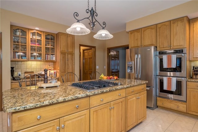 256 Queen Esther Dr, Sayre, PA 18840 - kitchen with appliances with stainless steel finishes, light stone counters, tasteful backsplash, and glass insert cabinets