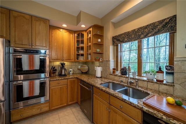 256 Queen Esther Dr, Sayre, PA 18840 - kitchen with stainless steel double oven, dishwasher, a sink, and stone counters