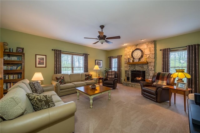 256 Queen Esther Dr, Sayre, PA 18840 - carpeted living area featuring ceiling fan and a fireplace