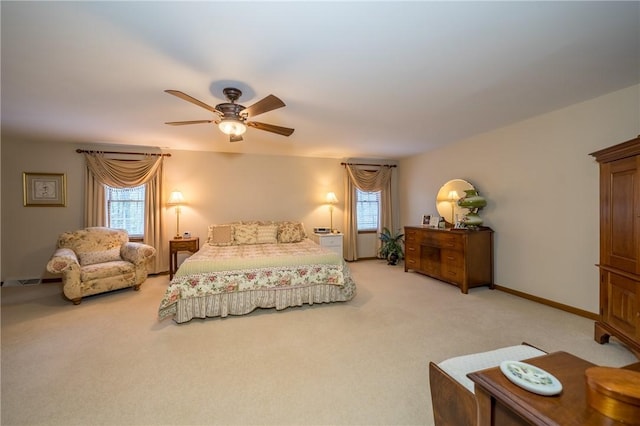 256 Queen Esther Dr, Sayre, PA 18840 - bedroom featuring light carpet, multiple windows, ceiling fan, and baseboards