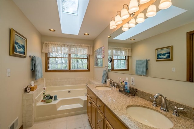 256 Queen Esther Dr, Sayre, PA 18840 - bathroom featuring a skylight, tile patterned floors, a garden tub, double vanity, and recessed lighting