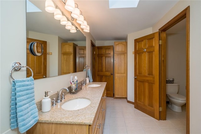256 Queen Esther Dr, Sayre, PA 18840 - bathroom featuring double vanity, tile patterned floors, and toilet