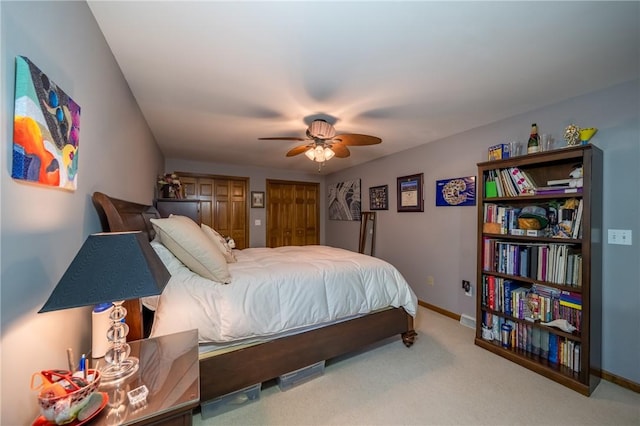 256 Queen Esther Dr, Sayre, PA 18840 - bedroom featuring multiple closets, carpet, baseboards, and a ceiling fan