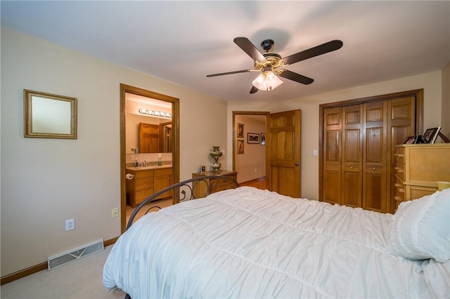 256 Queen Esther Dr, Sayre, PA 18840 - bedroom featuring a sink, a closet, ceiling fan, ensuite bath, and baseboards