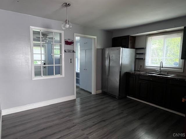 226 Darlington Rd, Syracuse, NY 13208 - kitchen with a sink, freestanding refrigerator, dark wood finished floors, and baseboards