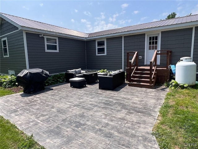 8 Office Rd, Fowler, NY 13642 - back of house with a patio, outdoor lounge area, and metal roof
