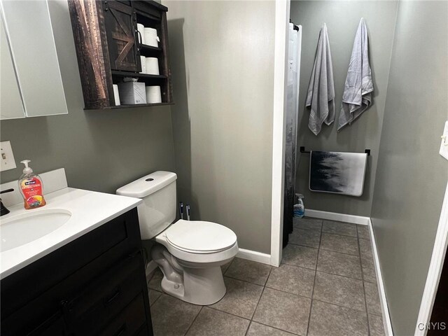 8 Office Rd, Fowler, NY 13642 - full bath with vanity, tile patterned floors, toilet, baseboards, and a shower with shower curtain